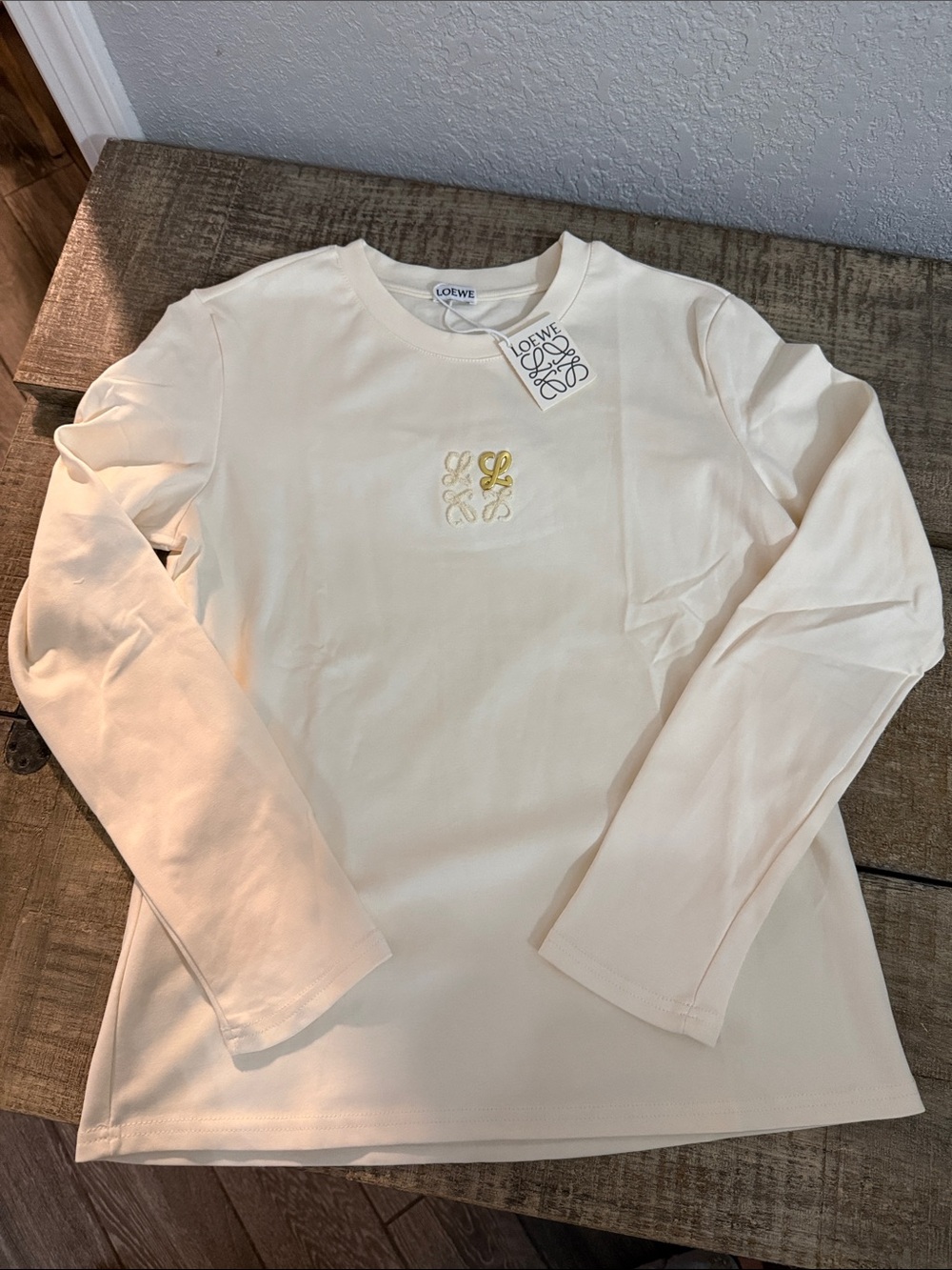 Cream Long Sleeve Tee with gold accent with cream Logo Embroidery